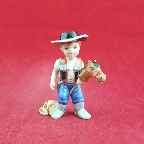 Royal Copenhagen Miniature Child Figure - Boy On Hobby Horse 011 - RCH 2047