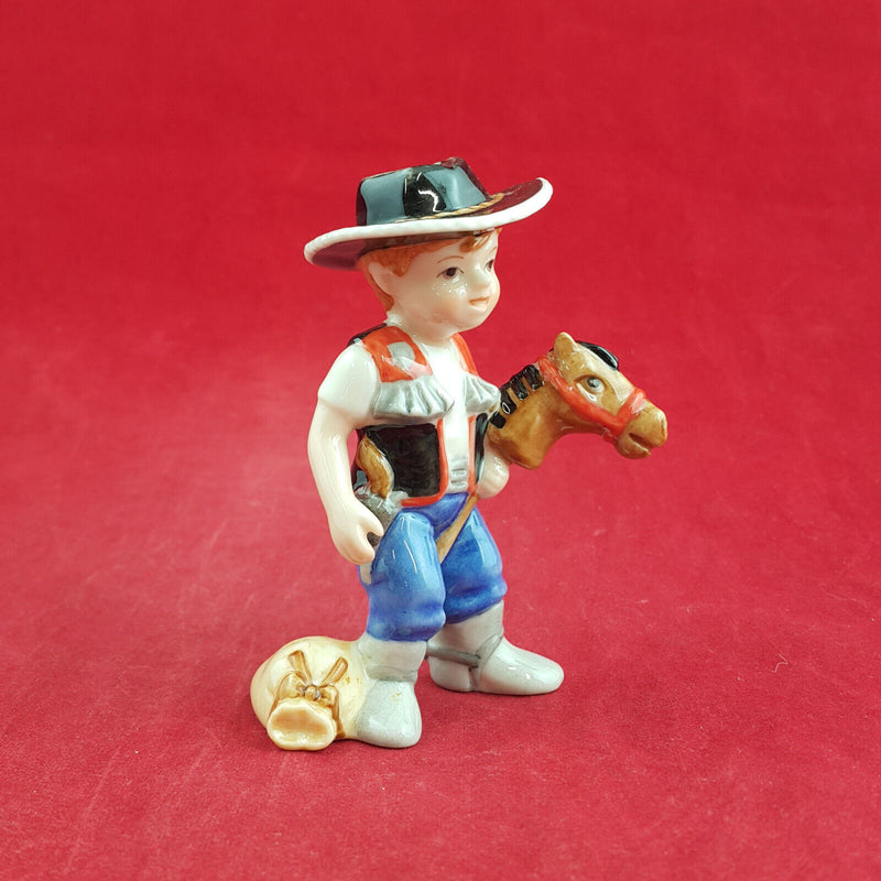 Royal Copenhagen Miniature Child Figure - Boy On Hobby Horse 011 - RCH 2047