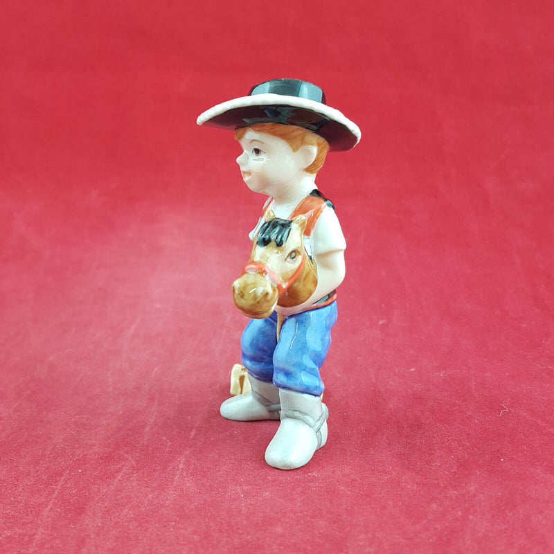 Royal Copenhagen Miniature Child Figure - Boy On Hobby Horse 011 - RCH 2047