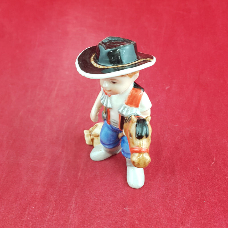 Royal Copenhagen Miniature Child Figure - Boy On Hobby Horse 011 - RCH 2047