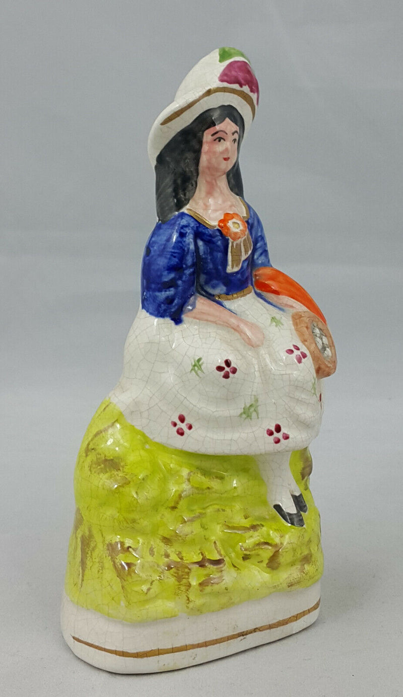 Staffordshire Figurine Lady in a Sitting Pose – Paint Chip