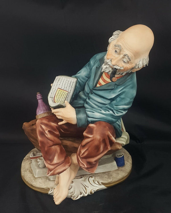 Capodimonte Figurine The Tramp Smoking Pipe and Reading Book - Damaged