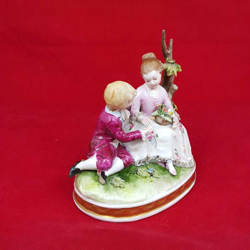 Capodimonte Porcelain Figural Group of Girl & Boy Seated on a Tree Branch