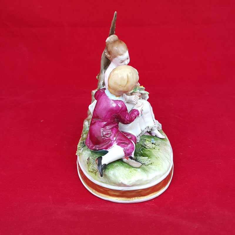 Capodimonte Porcelain Figural Group of Girl & Boy Seated on a Tree Branch