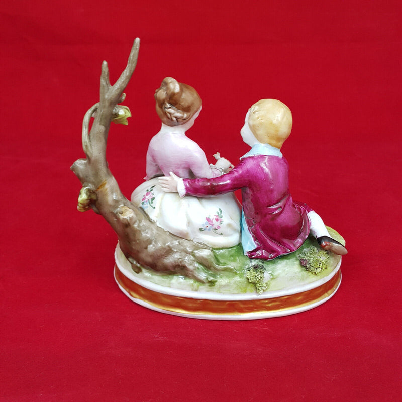 Capodimonte Porcelain Figural Group of Girl & Boy Seated on a Tree Branch