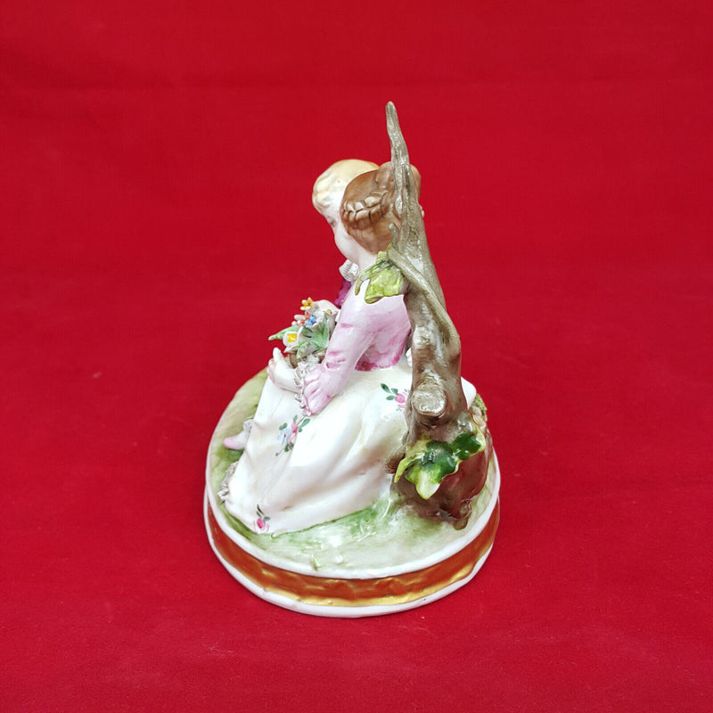 Capodimonte Porcelain Figural Group of Girl & Boy Seated on a Tree Branch