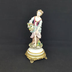 Capodimonte Figurine Lady with flower basket, metal base - damaged