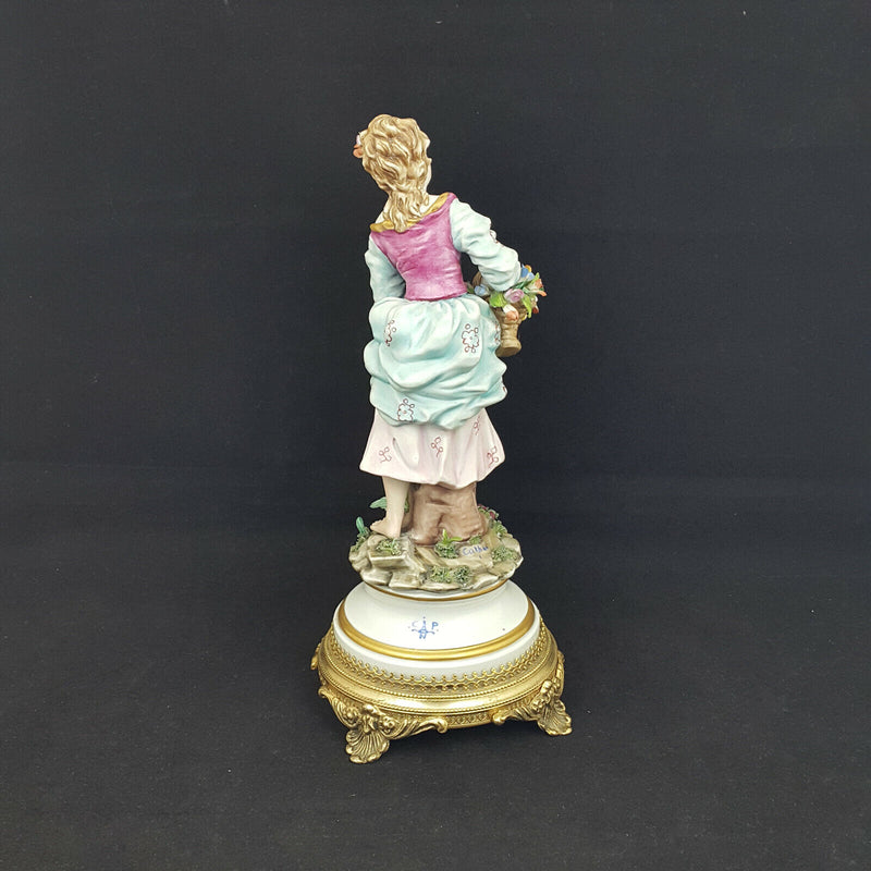 Capodimonte Figurine Lady with flower basket, metal base - damaged