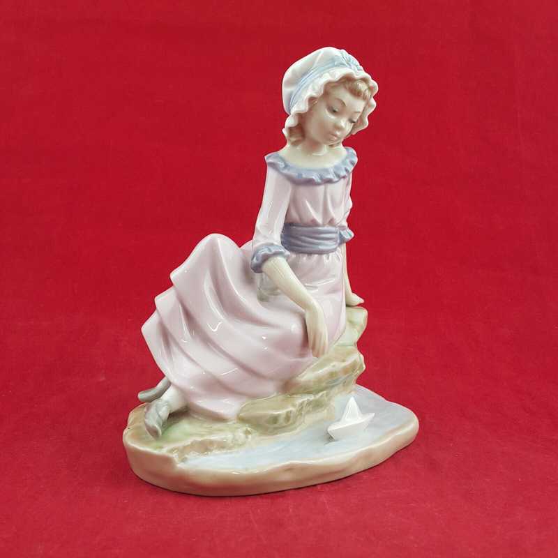 Nao By Lladro - Girl Sitting On The Edge Of Water With Floating Boat - L/N 2035