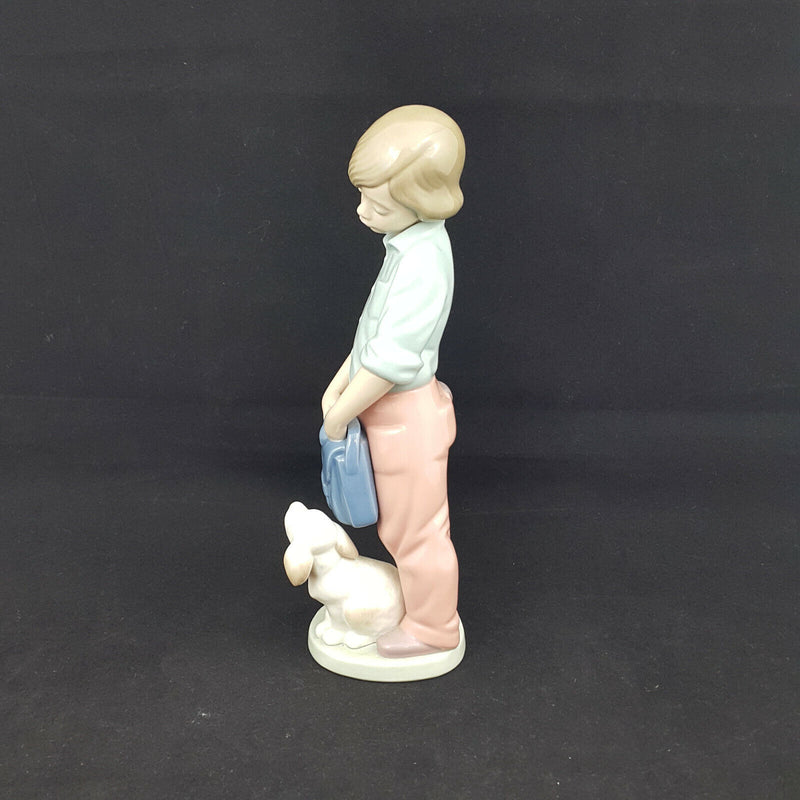 Nao Lladro Boy with Backpack and Dog -very sligh chip on back of neck, restrored