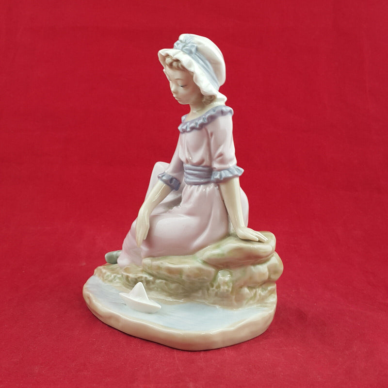 Nao By Lladro - Girl Sitting On The Edge Of Water With Floating Boat - L/N 2035