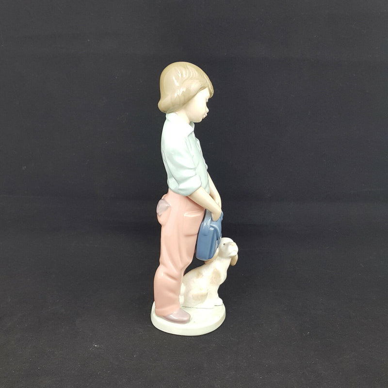 Nao Lladro Boy with Backpack and Dog -very sligh chip on back of neck, restrored