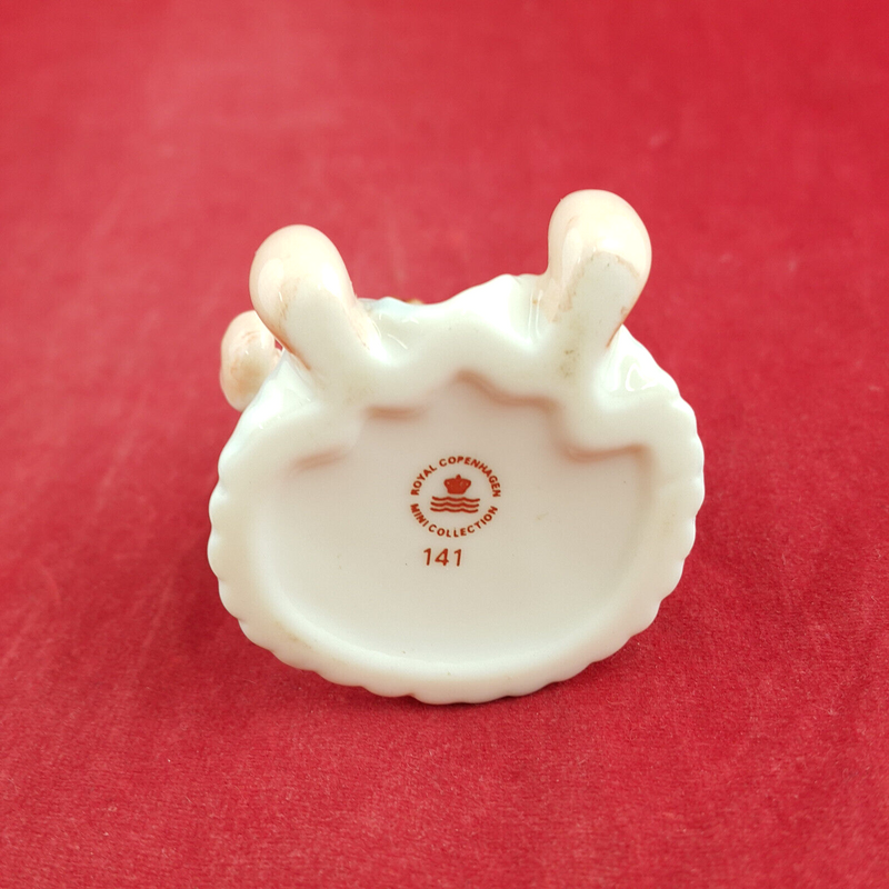 Royal Copenhagen Miniature Child Figure - Seated Doll 141 - RCH 2052