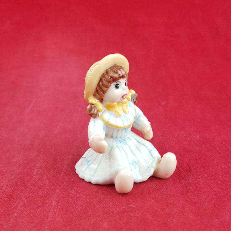 Royal Copenhagen Miniature Child Figure - Seated Doll 141 - RCH 2052