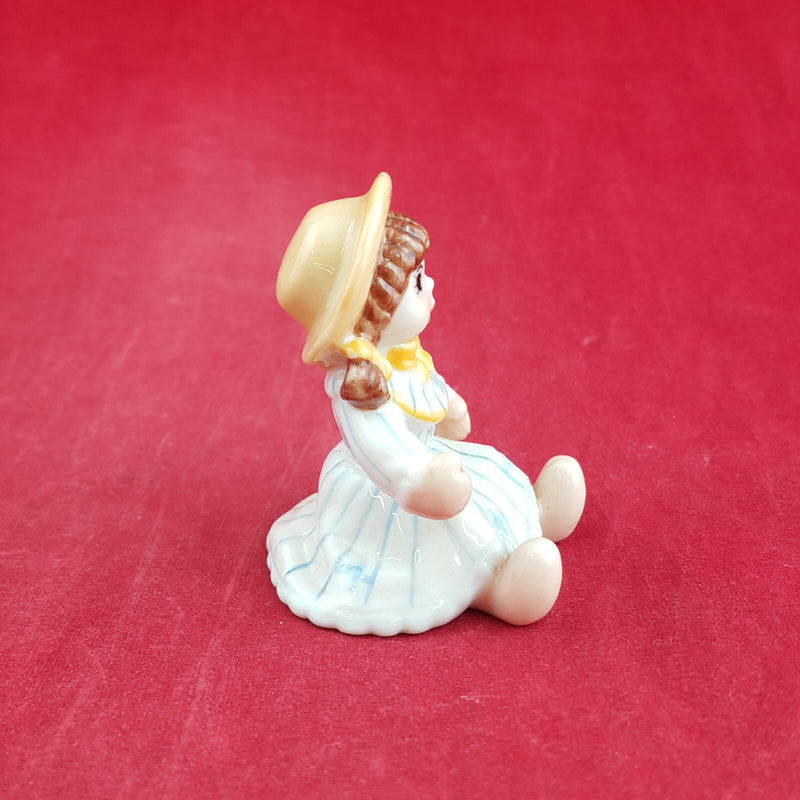 Royal Copenhagen Miniature Child Figure - Seated Doll 141 - RCH 2052