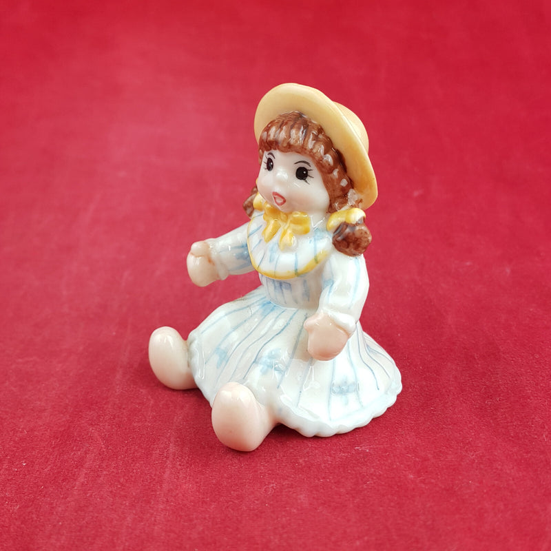 Royal Copenhagen Miniature Child Figure - Seated Doll 141 - RCH 2052
