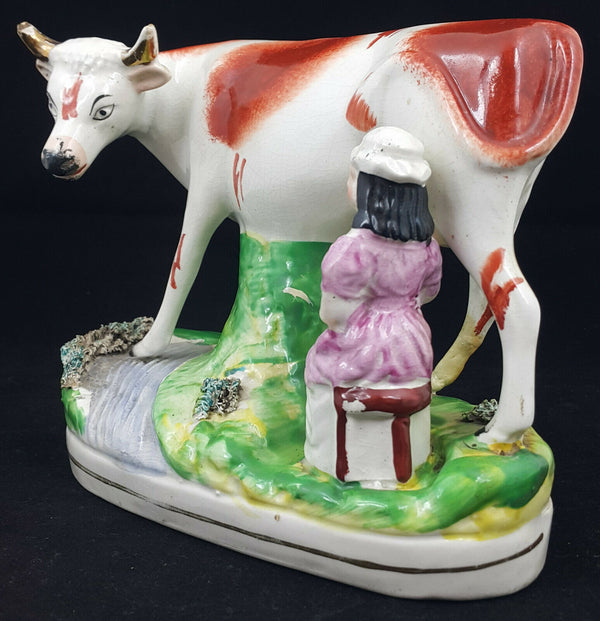 Staffordshire Figurine Lady Milking Cow - Ear Chipped