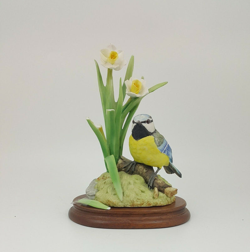 Blue Tit on a Log surrounded with Flowers on Plinth - Damaged