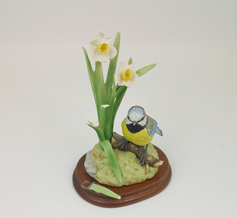 Blue Tit on a Log surrounded with Flowers on Plinth - Damaged