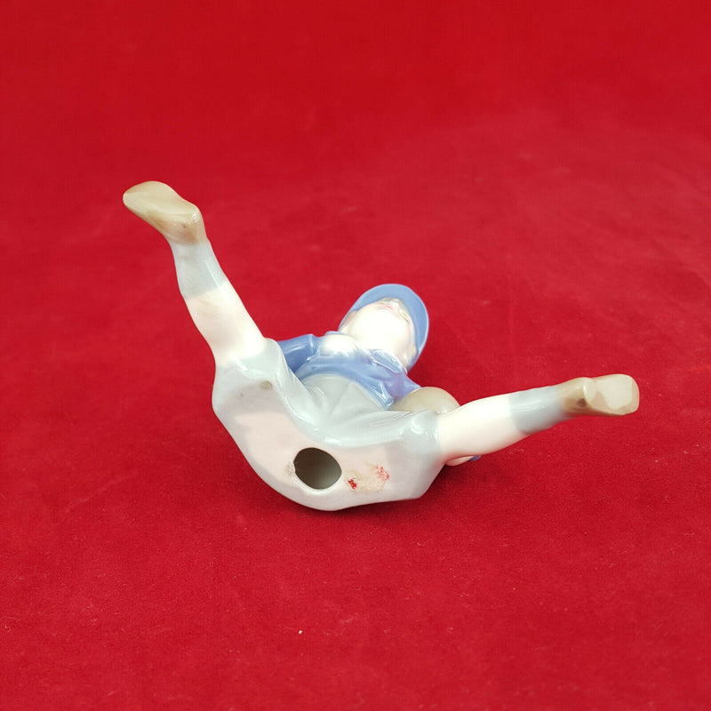 Unmarked Porcelain Figurine - Boy Sitting - NA 754