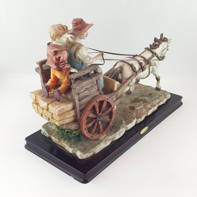 The Juliana Collection - Man With A Boy Riding Horse Cart - NA 1625