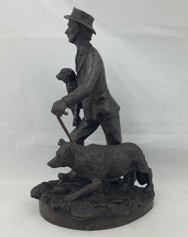 Bronze Shepherd Carrying Baby Sheep & Walking Dog