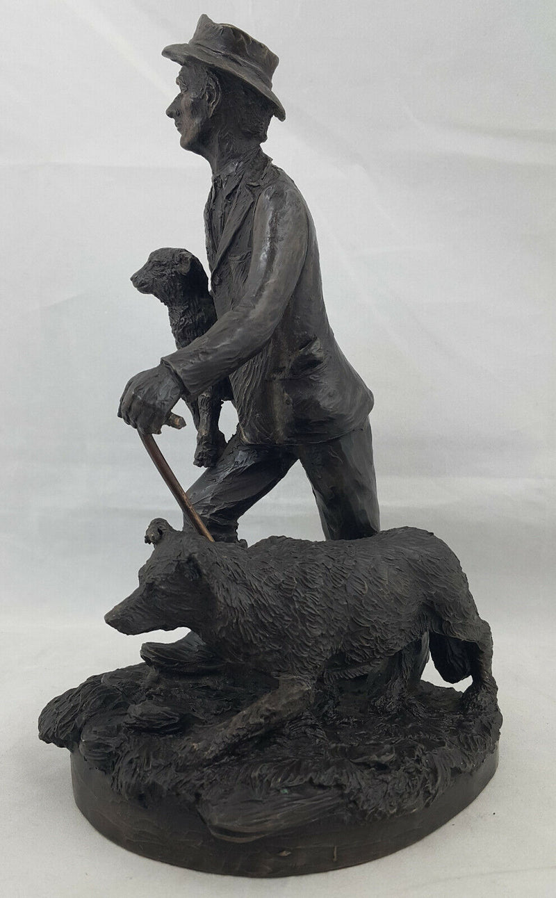 Bronze Shepherd Carrying Baby Sheep & Walking Dog