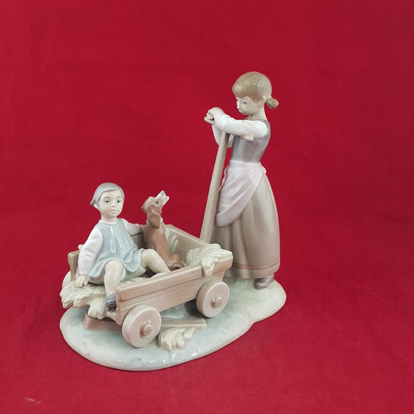 Lladro Figurine 1245 - Girl Pulling Cart With Boy and Dog - 6959 L/N
