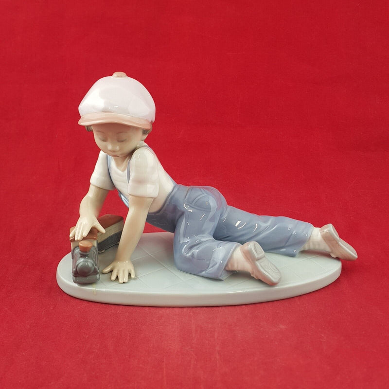 Lladro Figurine 7619 - All Aboard Boy Playing with Train - 7568 L/N