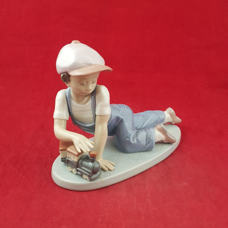 Lladro Figurine 7619 - All Aboard Boy Playing with Train - 7568 L/N