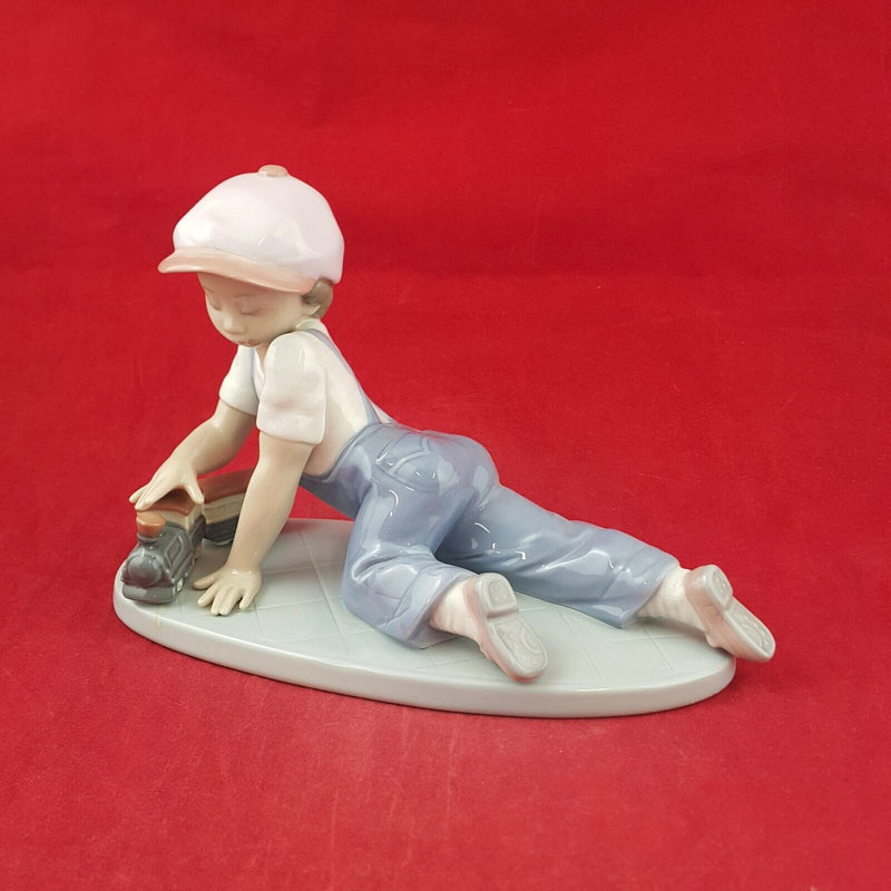 Lladro Figurine 7619 - All Aboard Boy Playing with Train - 7568 L/N