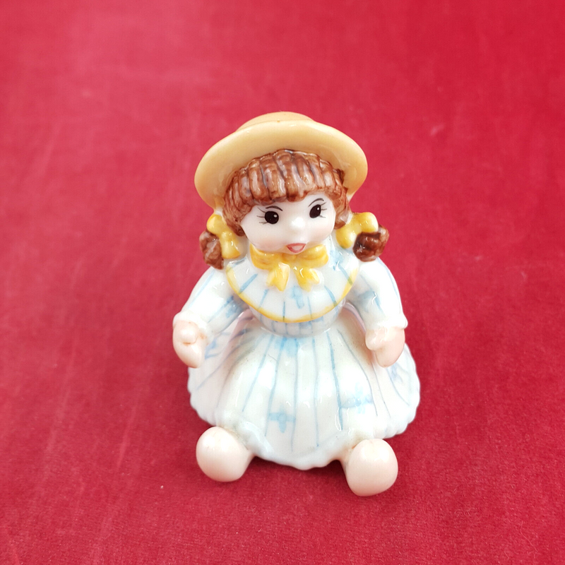 Royal Copenhagen Miniature Child Figure - Seated Doll 141 - RCH 2052